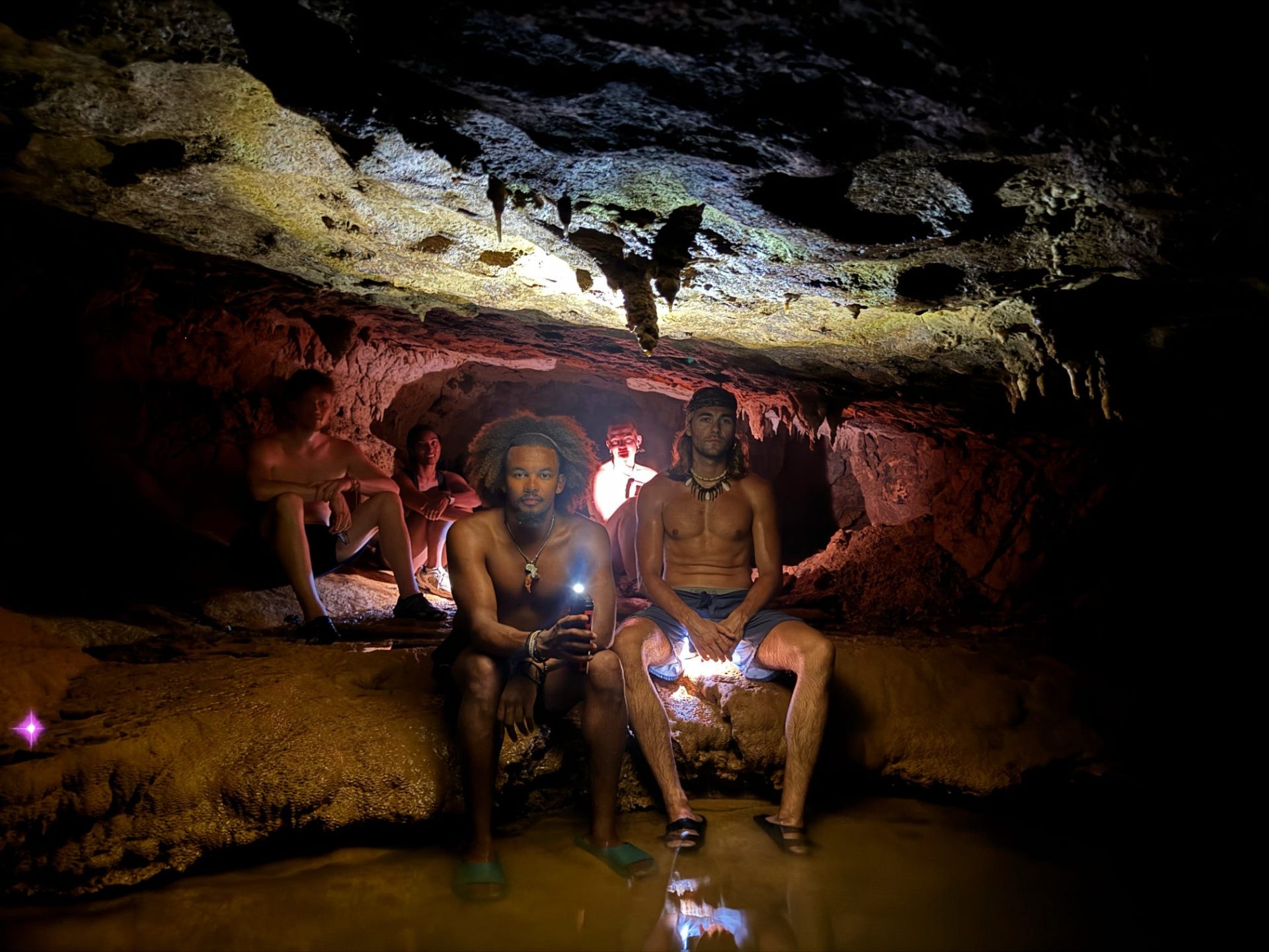 Inside the cave, headlamps lit, Juan & Lonely