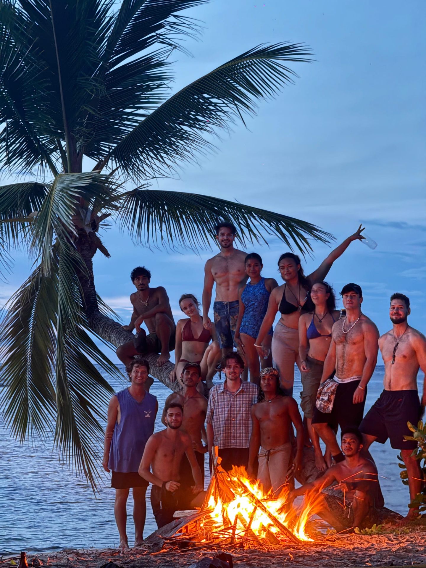 Beach bonfire under the leaning palm, Juan & Lonely